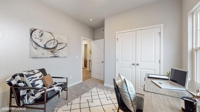 office area with light colored carpet