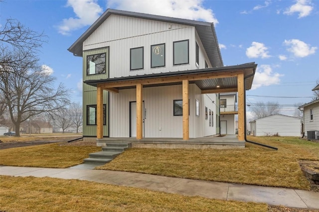 view of front of property featuring a porch, a front yard, and cooling unit