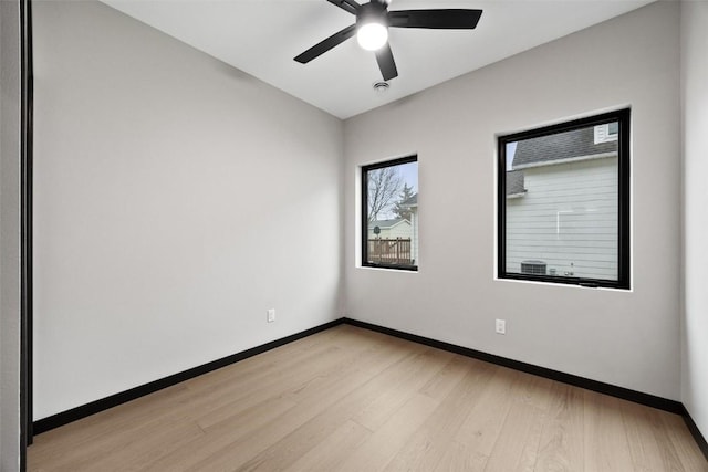 unfurnished room featuring ceiling fan and light hardwood / wood-style floors