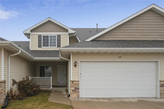 view of front of house with a garage and covered porch