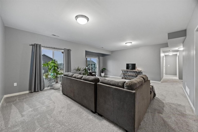 living room featuring light colored carpet