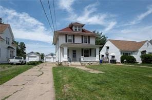 view of front of property with a porch and a front lawn