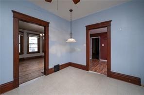 unfurnished room featuring ceiling fan