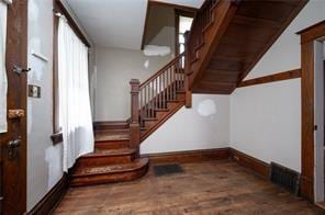 stairway with wood-type flooring