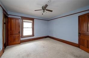 unfurnished bedroom with light carpet and ceiling fan