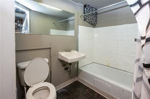 full bathroom with toilet, sink, and bathing tub / shower combination