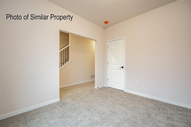 view of carpeted spare room