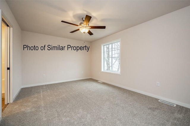 carpeted empty room with ceiling fan