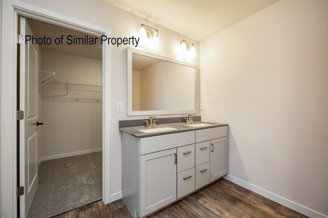 bathroom featuring wood-type flooring and vanity