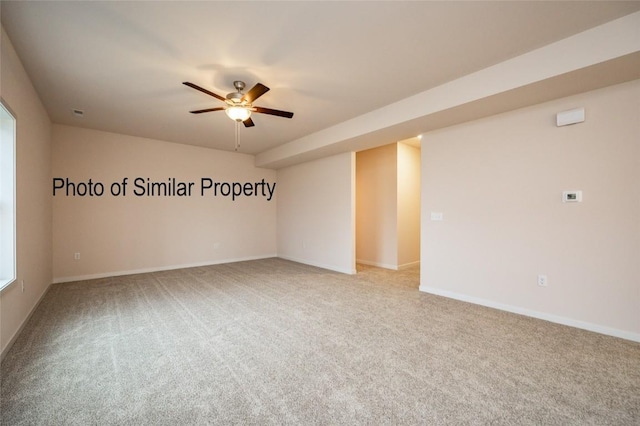 unfurnished room featuring carpet and ceiling fan