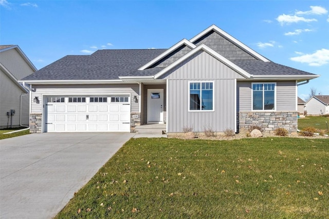 craftsman-style home featuring a garage and a front lawn