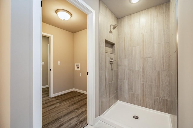 bathroom with hardwood / wood-style floors and walk in shower