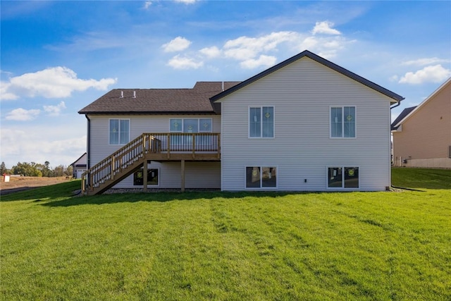 back of house with a deck and a yard