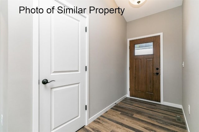 foyer with dark hardwood / wood-style floors