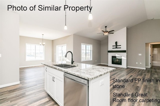 kitchen featuring a center island with sink, white cabinets, sink, hanging light fixtures, and stainless steel dishwasher