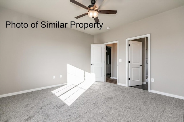 unfurnished bedroom featuring ceiling fan and dark colored carpet