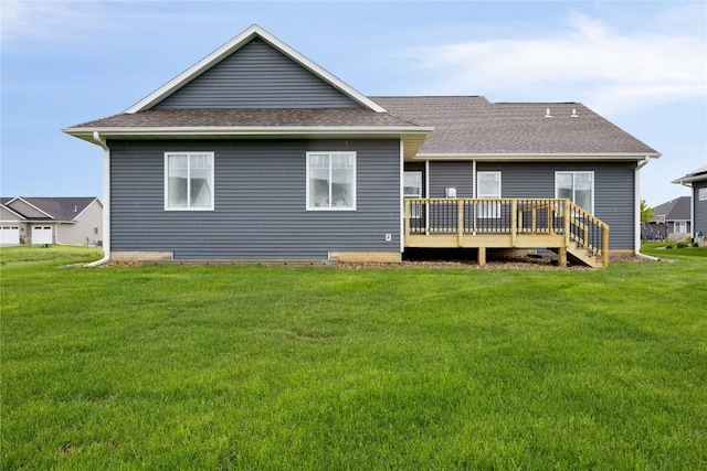 back of house with a lawn and a wooden deck