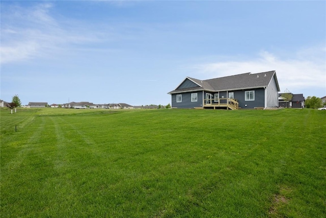 view of yard featuring a wooden deck