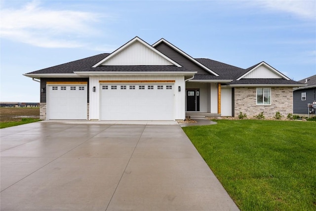 view of front of house with a garage and a front yard