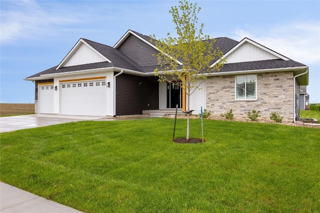 view of front facade with a garage and a front lawn