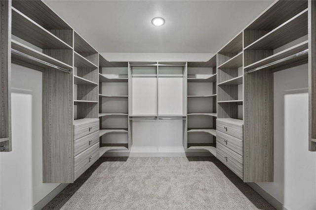 spacious closet featuring dark carpet