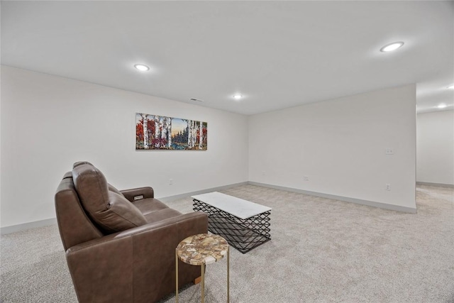 carpeted living area with baseboards, recessed lighting, and visible vents
