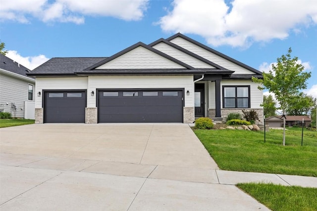 craftsman-style house with a garage and a front yard