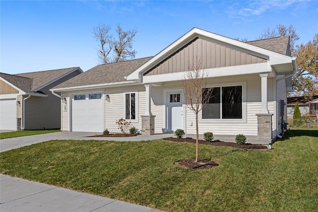 view of front of property featuring a garage and a front yard