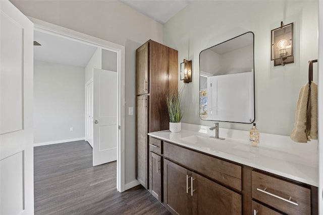 bathroom featuring hardwood / wood-style flooring and vanity