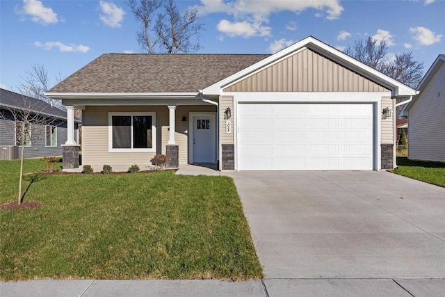 view of front of home with a garage and a front lawn