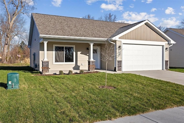 view of front of property featuring a garage and a front yard