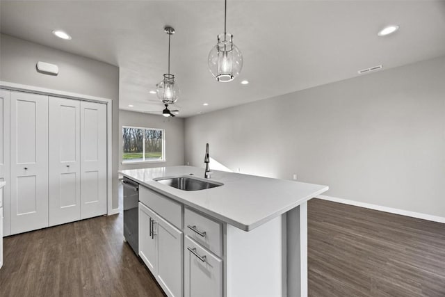 kitchen with dishwasher, sink, decorative light fixtures, a center island with sink, and white cabinets