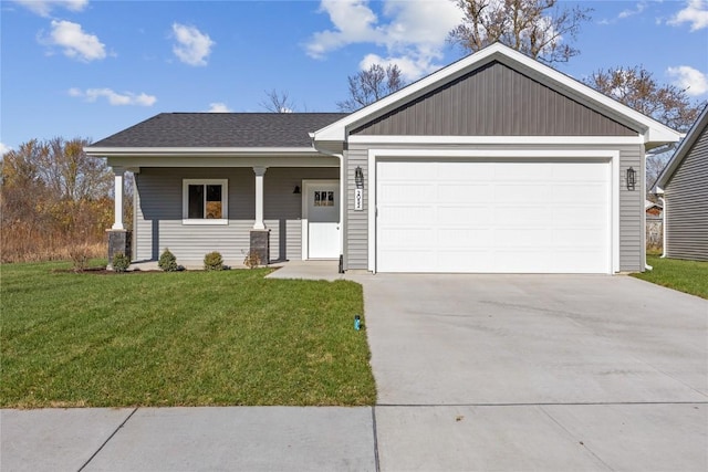 view of front of home featuring a front yard, a porch, and a garage