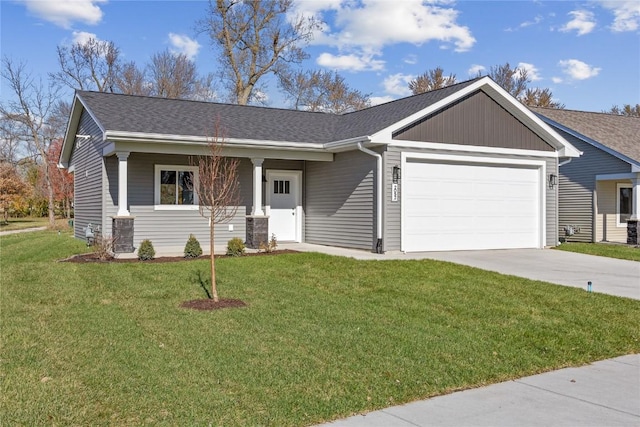 view of front of home featuring a front lawn, central AC unit, and a garage