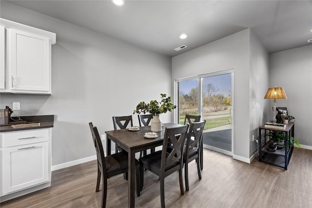 dining room with dark wood-type flooring