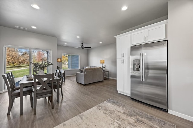 dining area featuring hardwood / wood-style flooring and ceiling fan