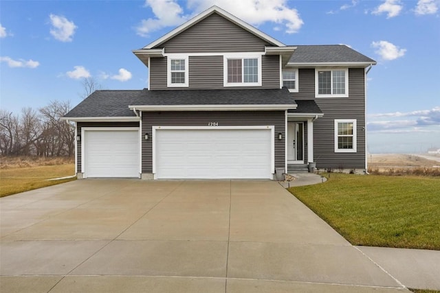 front facade with a garage and a front lawn