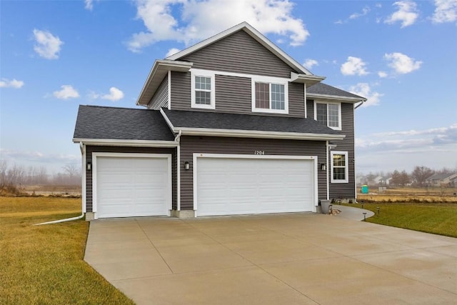 view of front of home with a garage and a front yard