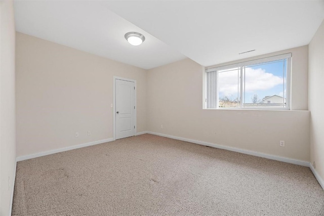 spare room featuring carpet flooring