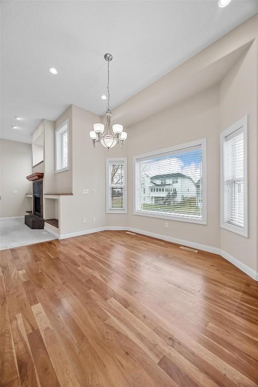 interior space featuring a chandelier and light hardwood / wood-style flooring