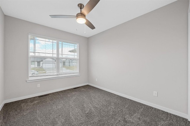 carpeted empty room featuring ceiling fan