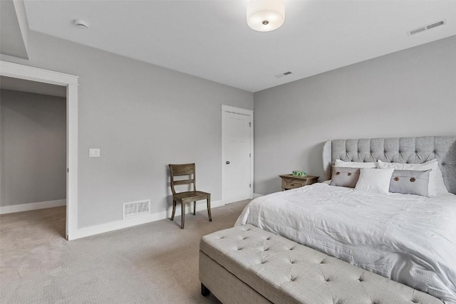 bedroom featuring light colored carpet