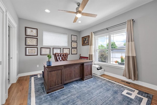 office area with dark hardwood / wood-style floors and ceiling fan