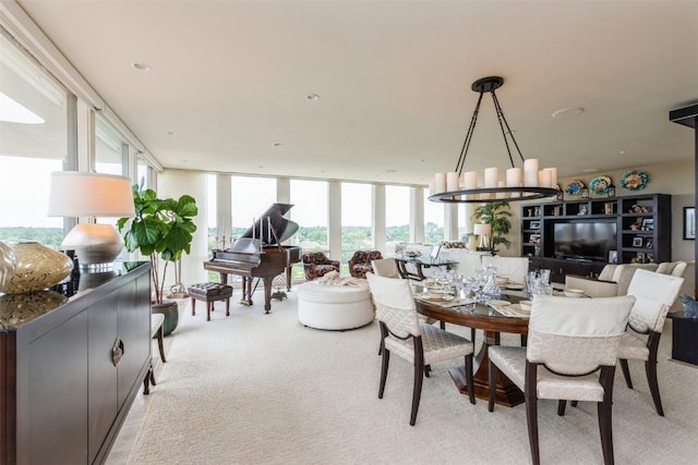 carpeted dining space featuring a wall of windows