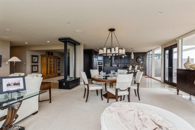 dining room featuring expansive windows and french doors