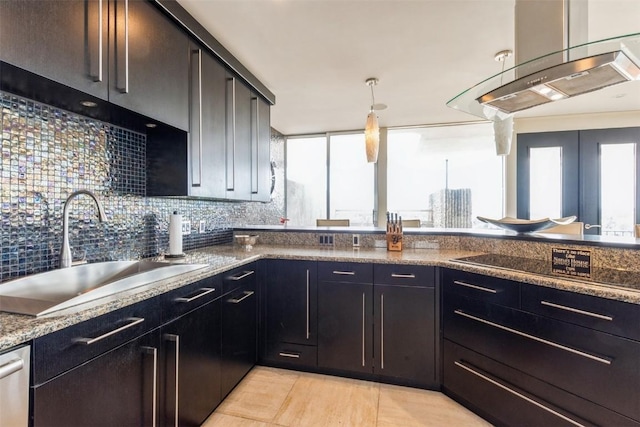 kitchen featuring decorative backsplash, stainless steel dishwasher, dark stone countertops, and sink