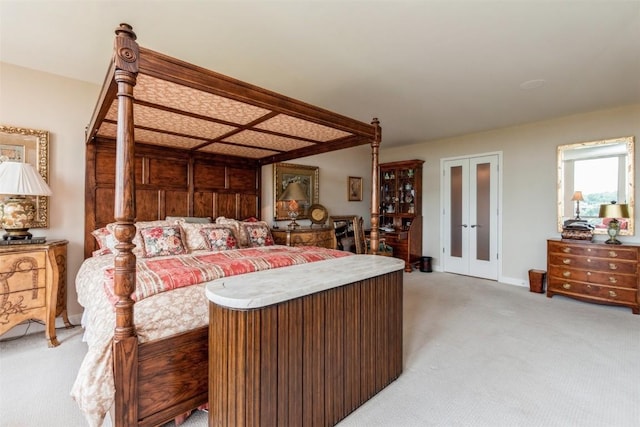 bedroom with light carpet and french doors