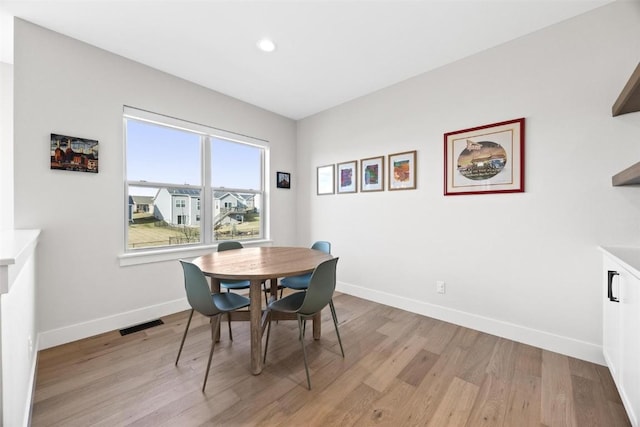 dining room with light hardwood / wood-style flooring