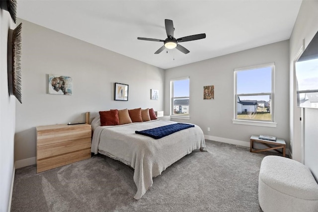 bedroom with dark carpet and ceiling fan