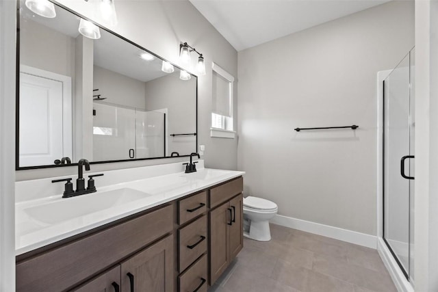 bathroom featuring vanity, toilet, and walk in shower